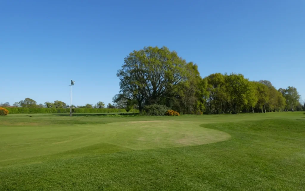 A flagstick on a golf green at Heslington, England.