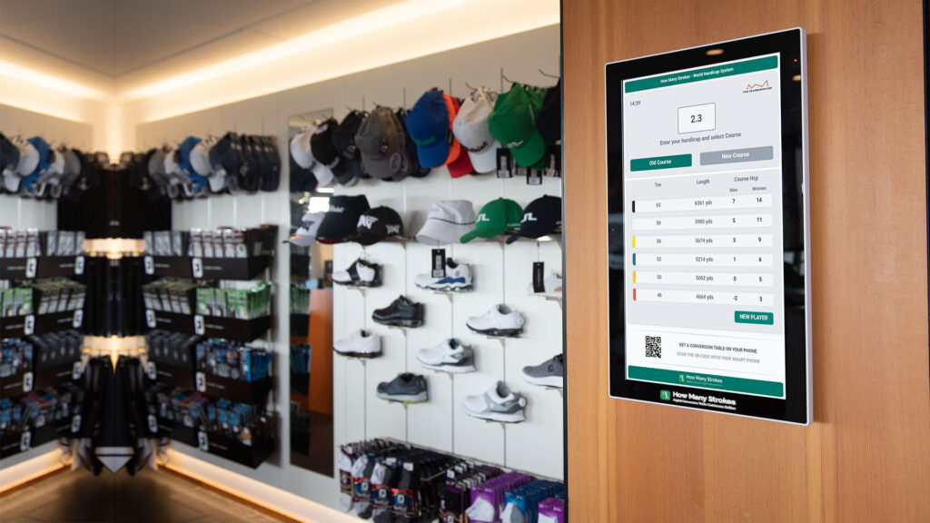 A digital handicap conversion table displayed inside a golf clubhouse.